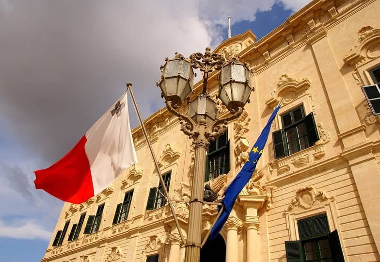Auberge de Castille in Valletta flying the National Flag of Malta and the European Union Flag